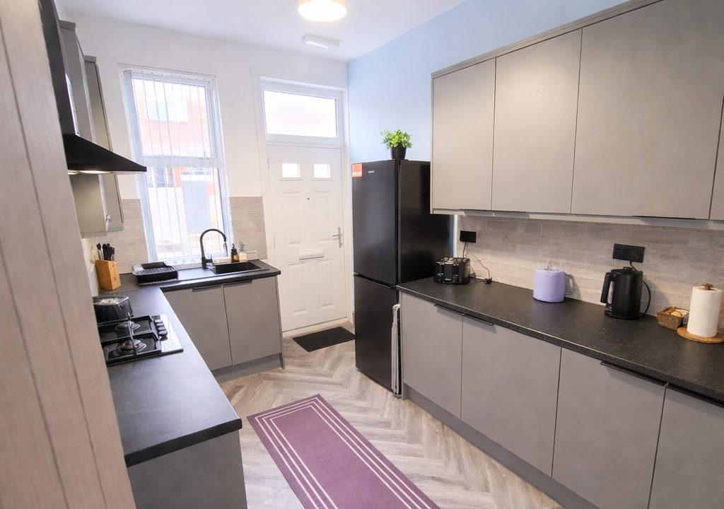 Modern galley kitchen with vibrant accents